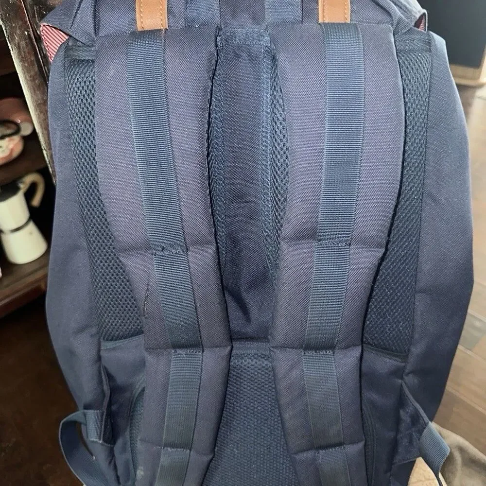 Herschel backpack with pocket. One button is missing, kept it in the front zip.